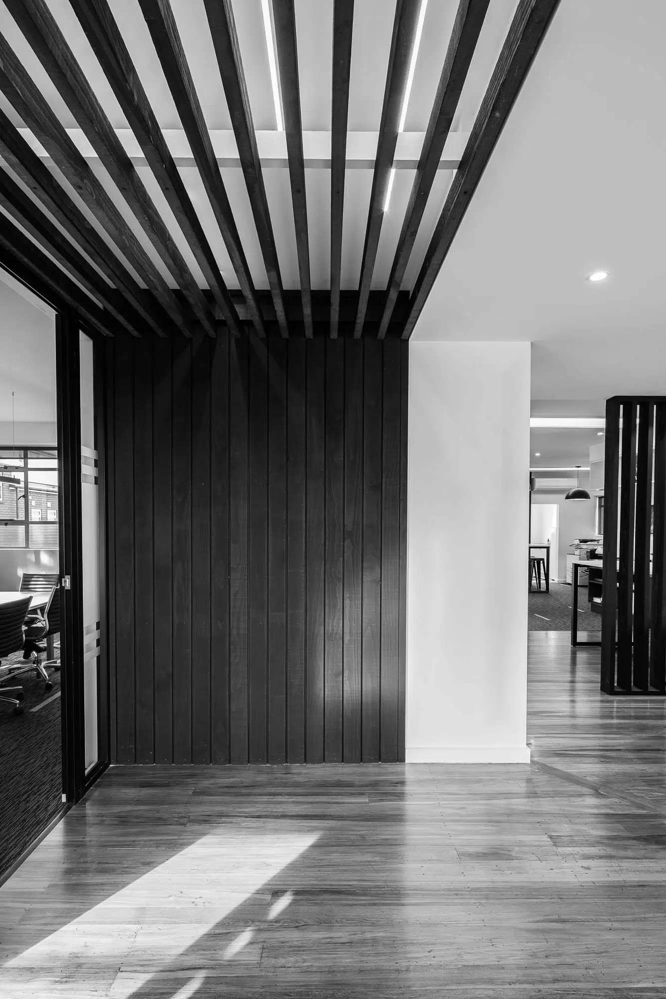 Chilton + Mayne studio interior in Christchurch with dark timber batten ceiling feature and vertical wall cladding