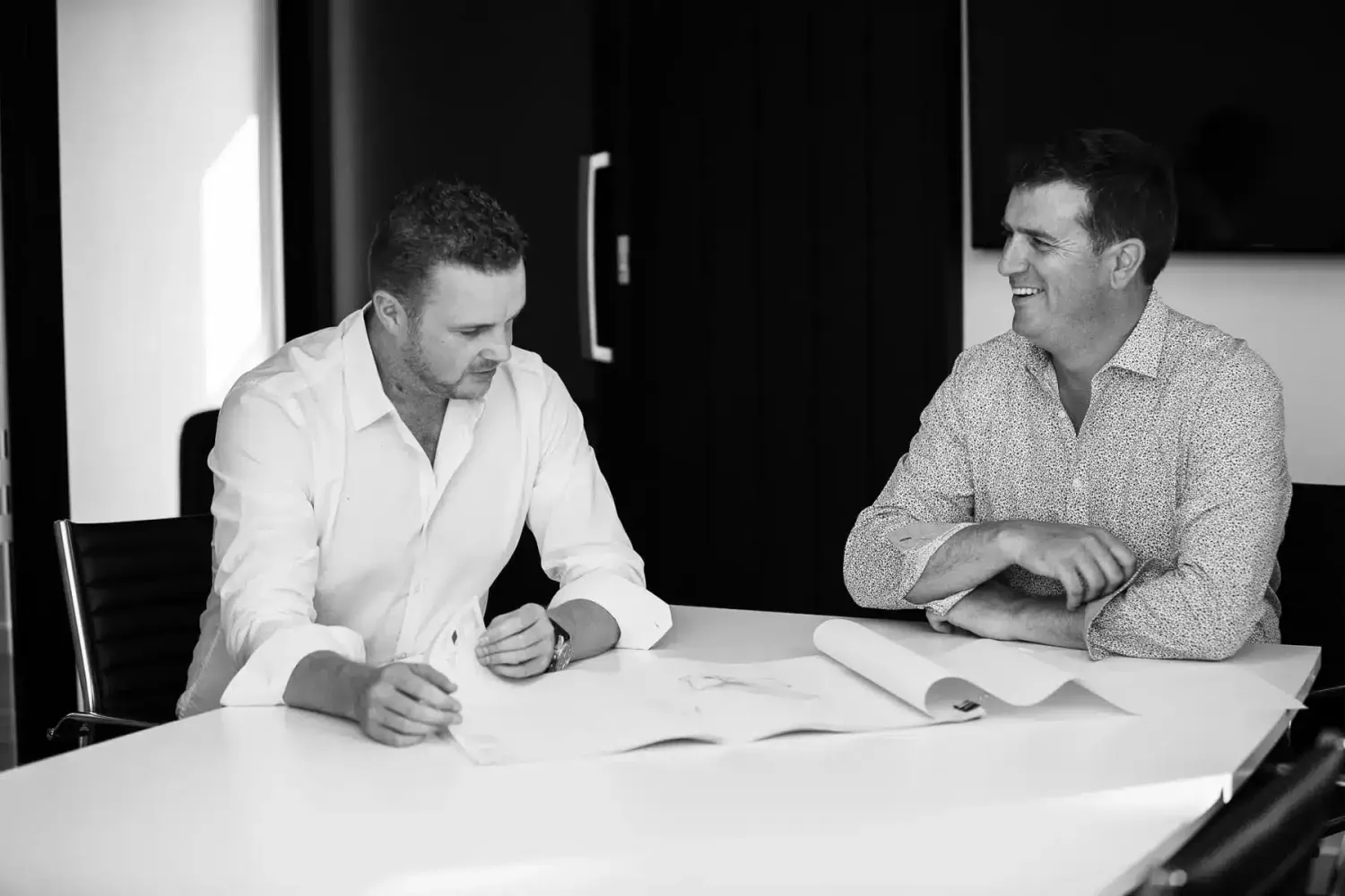 Gary and David, directors of Chilton + Mayne architectural designers, reviewing house plans at the studio in Christchurch
